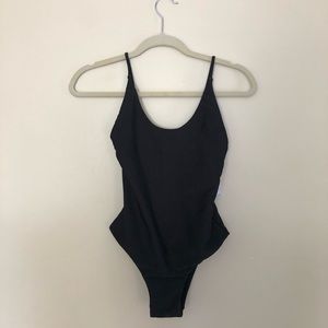 Black Ribbed One-Piece from Pacsun